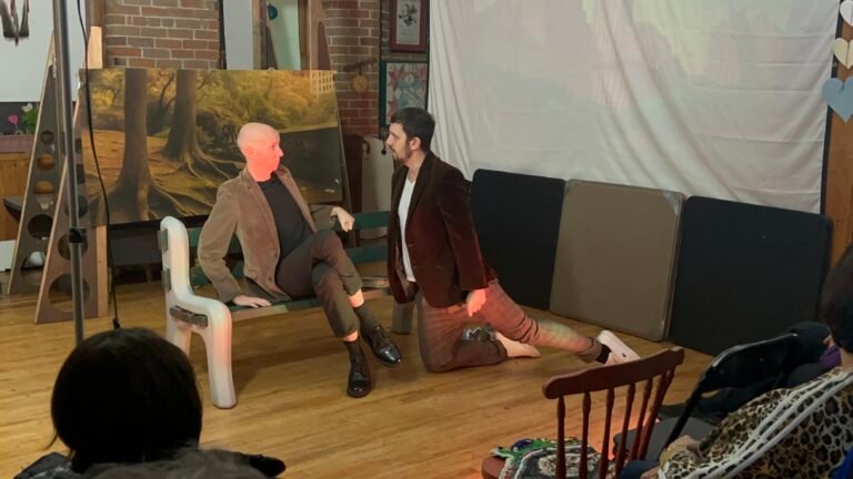 Konstantine Malakos as Jerry mimics a dog growling as Josh Cledenin as Peter is taken aback